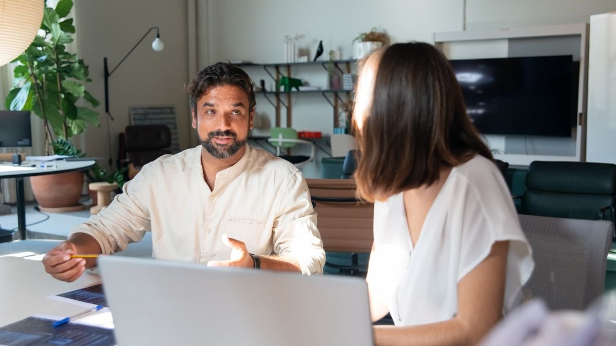 An adviser talking a client through scheme conditions