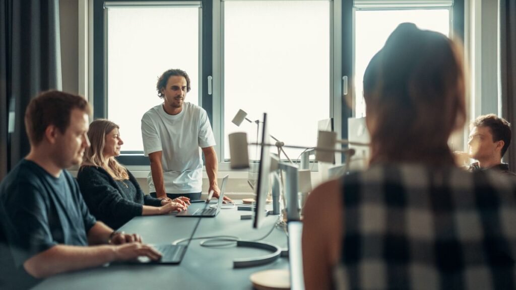 A team in a modern office discussing an early-stage plan